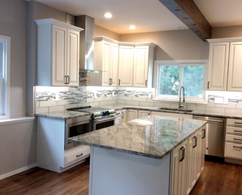 kitchen remodel, whie cabinets, granite counter tops, stainless steel appliances, glass tile backsplash, can lights