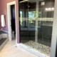bathroom remodel, gray vanity, custom shower wall tile, glass door shower, frameless glass shower